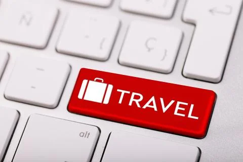 Computer keyboard with red button and word Travel. Tourist agency Stock Illustration