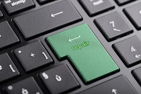 Computer keyboard with "repair" button, selected focus on enter button Stock Photos