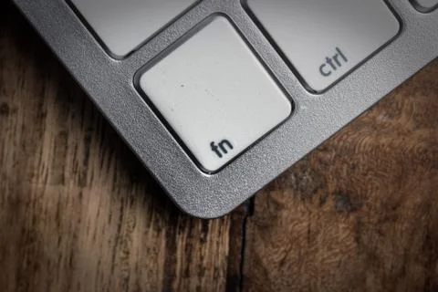 Computer keyboard - silver keyboard of a laptop with button Fn isolated. Home Stock Photos