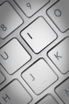Computer keyboard - silver keyboard of a laptop with button I isolated. Home  Stock Photos