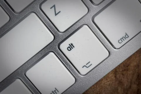 Computer keyboard - silver keyboard of a laptop with button ALT isolated. Hom Stock Photos