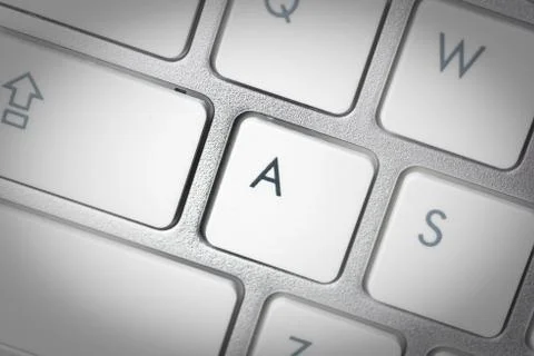 Computer keyboard - silver keyboard of a laptop with button A isolated. Home  Stock Photos