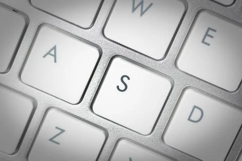 Computer keyboard - silver keyboard of a laptop with button S isolated. Home  Stock Photos