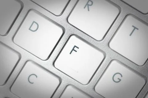 Computer keyboard - silver keyboard of a laptop with button F isolated. Home  Foto stock