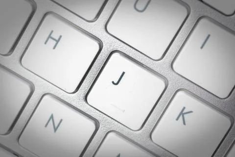 Computer keyboard - silver keyboard of a laptop with button J isolated. Home  Stock Photos