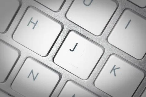 Computer keyboard - silver keyboard of a laptop with button J isolated. Home  Stock Photos