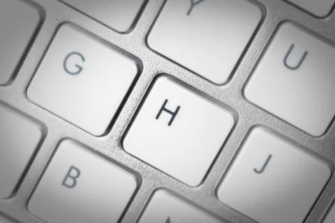 Computer keyboard - silver keyboard of a laptop with button H isolated. Home  Stock-Fotos