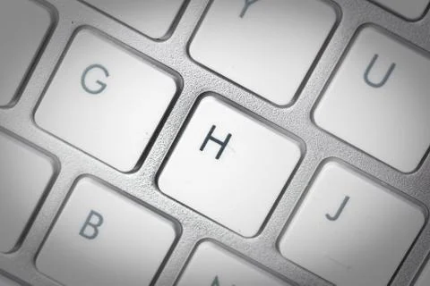 Computer keyboard - silver keyboard of a laptop with button H isolated. Home  Stock Photos