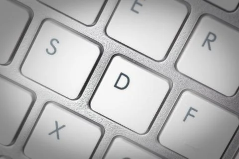 Computer keyboard - silver keyboard of a laptop with button D isolated. Home  Stock Photos