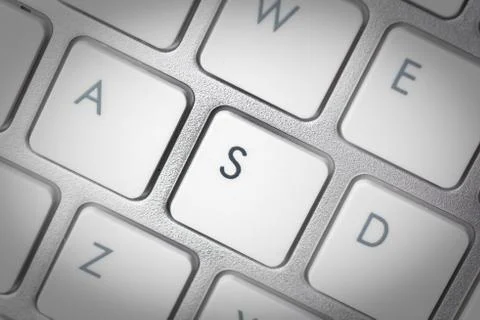 Computer keyboard - silver keyboard of a laptop with button S isolated. Home  Stock Photos