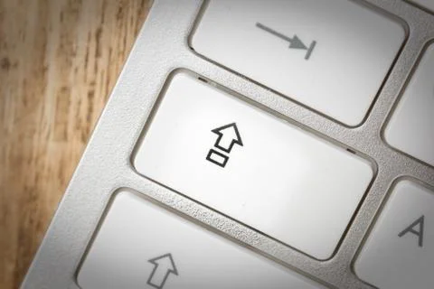 Computer keyboard - silver keyboard of a laptop with button SHIFT isolated. H Stock Photos