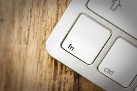 Computer keyboard - silver keyboard of a laptop with button Fn isolated. Home Stock Photos