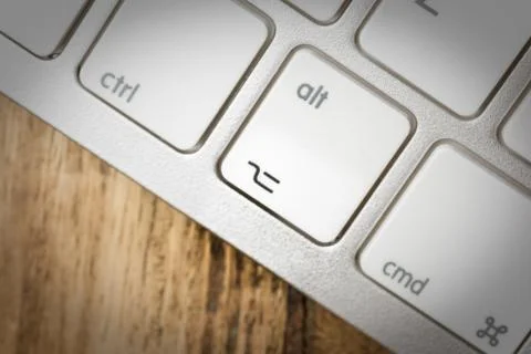 Computer keyboard - silver keyboard of a laptop with button ALT isolated. Hom Stock Photos