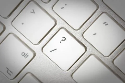 Computer keyboard - silver keyboard of a laptop with button Question Mark iso Stock Photos