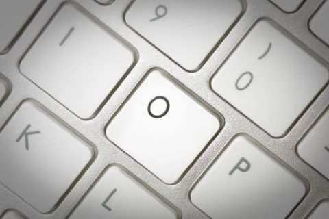 Computer keyboard - silver keyboard of a laptop with button O isolated. Home  Stock Photos