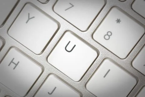 Computer keyboard - silver keyboard of a laptop with button U isolated. Home  Stock Photos