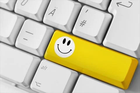Computer keyboard with smile key Stock Photos