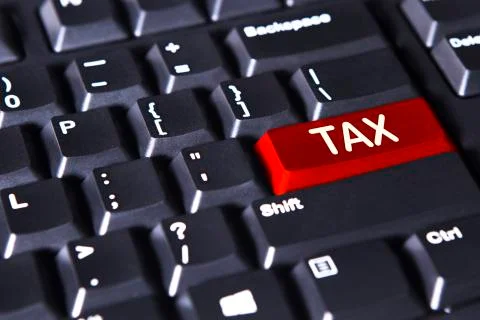 Computer keyboard with tax word Stock Photos