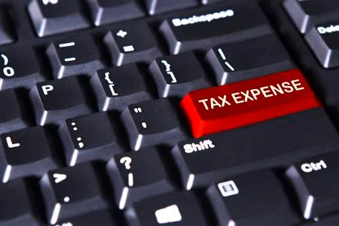Computer keyboard with text of tax expense Stock Photos