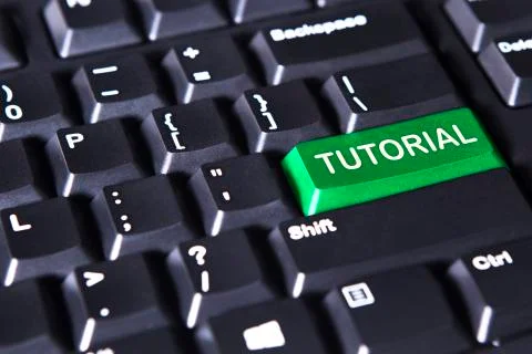 Computer keyboard with tutorial word Stock Photos