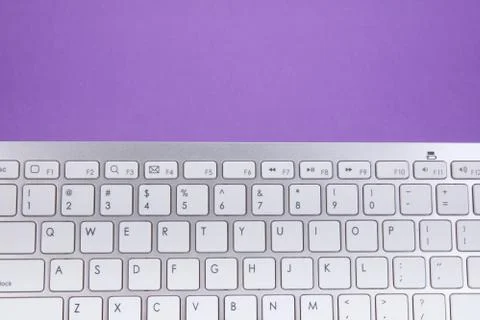 Computer keyboard on violet background 스톡 사진