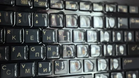 The computer keyboard was filled with water. Water soaked the keyboard keys Stock Footage 230681717