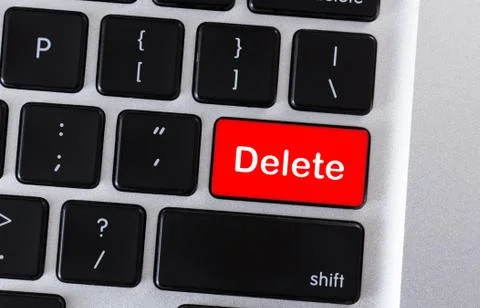 Computer keyboard with word Delete on button Stock Photos
