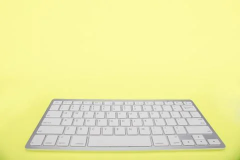 Computer keyboard on yellow background 스톡 사진