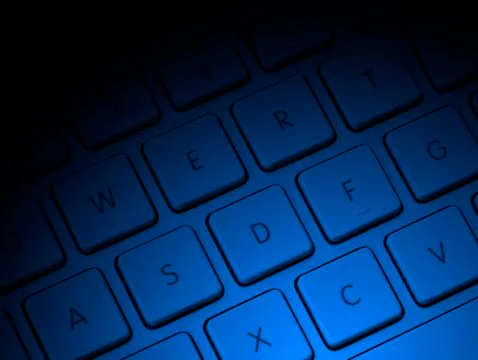 Computer keys with blue lighting Stock Photos