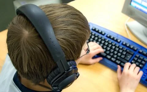 Computer Kid with Headphones Photos