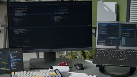 Computer, Laptop and Tablet on Desk of Software Engineer in Office Video stock 335940815