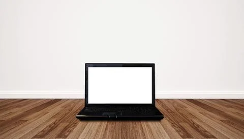 Computer laptop blank empty white screen, on wooden floor and white wall Stock Photos