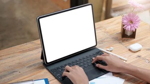 Computer Laptop with blank screen on table of coffee shop blur background with Stock Photos