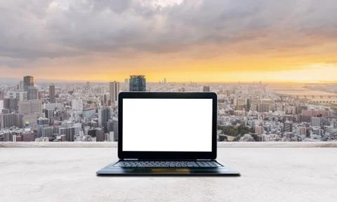 Computer laptop blank white screen on white concrete desk Stock Photos
