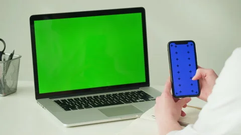 Computer laptop with green chroma key close-up. Doctor workplace, woman nurse Stock Footage 198737410