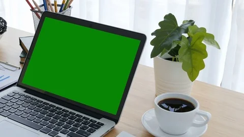 Computer laptop green screen on workplace table. 動画素材 81262610