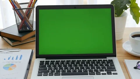 Computer laptop green screen on workplace table. Stock Footage 81265376