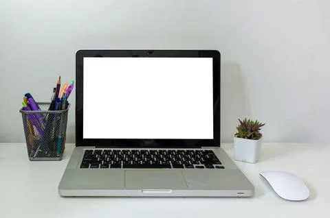 Computer laptop mock up and mouse Cactus white blank screen on table. Used .. Foto stock