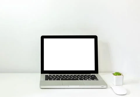 Computer laptop mock up and mouse Cactus white blank screen on table. Used .. Stock Photos