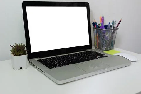 Computer laptop mock up blank white touch screen on desk. Used to put text .. Stock Photos