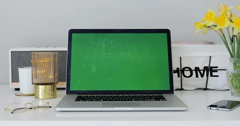 Computer Laptop with mock-up green chroma key screen. Home office environment Stock Footage 127645498