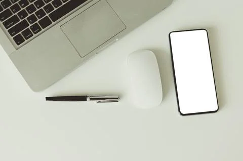 Computer laptop mock up smart phone and mouse and pen on background top vie.. Stock Photos