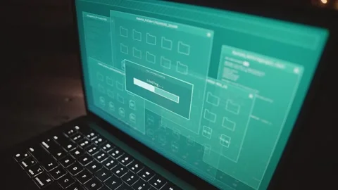 Computer laptop on office desk at night as software system loading information Видео 330740299
