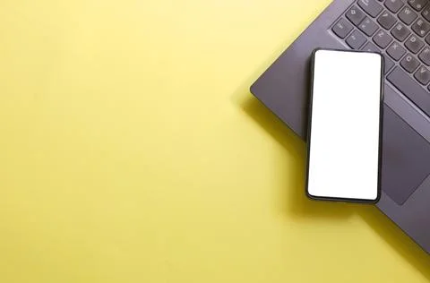 Computer, laptop, smartphone isolated screen on yellow background workspace Stock Photos