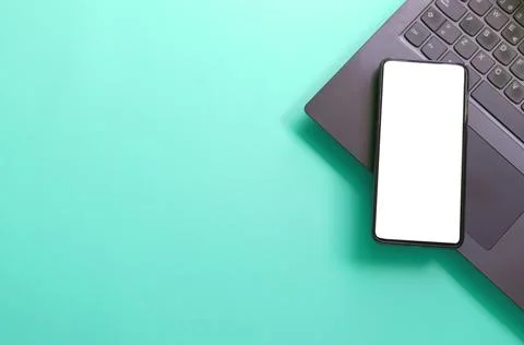 Computer, laptop, smartphone isolated screen on green background workspace Stock Photos