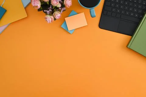 Computer laptop, sticky notes, coffee cup and notebook on yellow background. Stock Photos