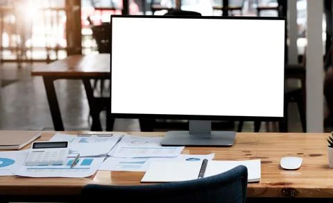 Computer laptop with white blank screen putting on wooden working desk that.. 스톡 사진