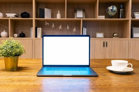 Computer laptop with white screen on the table at home. Stock-Fotos