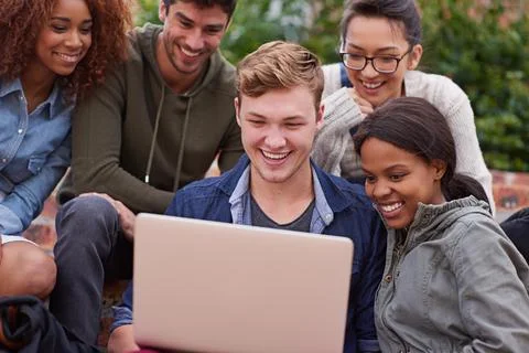 Computer, laughing and group of students outdoor in university learning Stockfoto's
