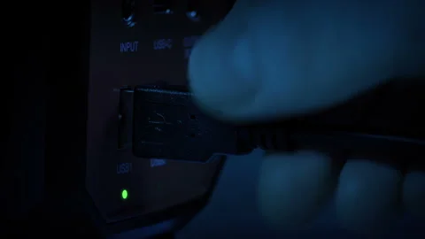 Computer Lead Is Plugged In Or Unplugged In Dark Room Stock-Footage 260063590